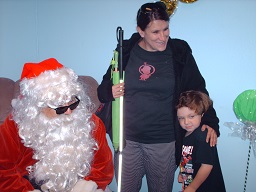A Mother and her child posing with Santa